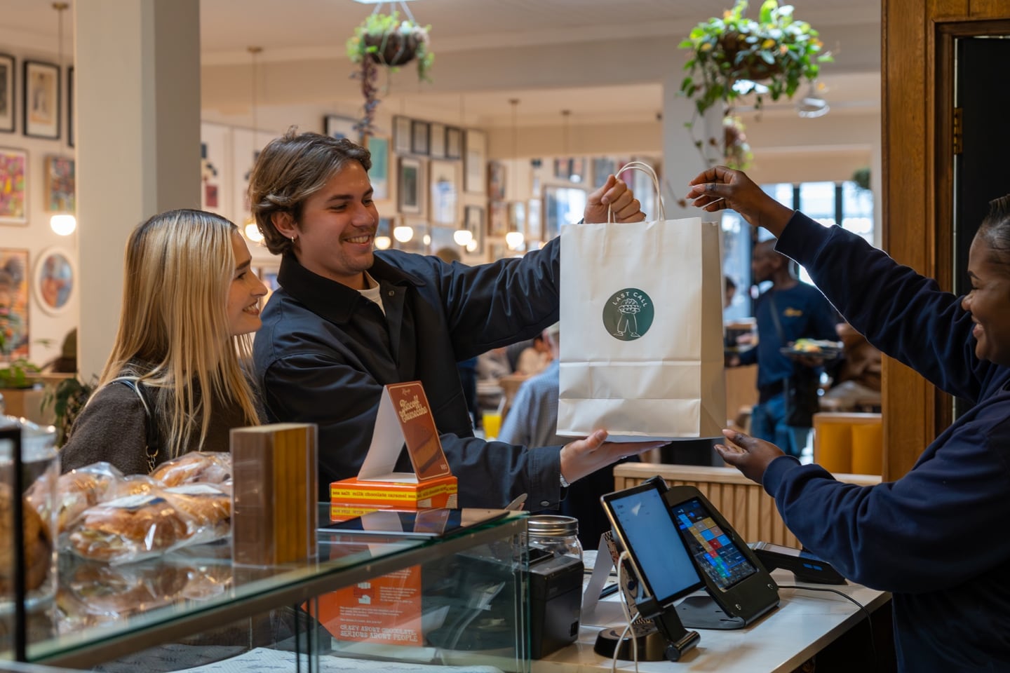 Customer receiving a Last Call bag